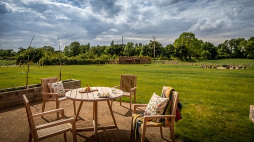 The outdoor seating and shared garden at Canal Barn, Shropshire